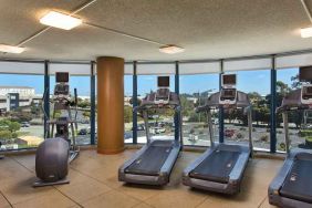 Fitness center with treadmills at the Embassy Suites by Hilton San Francisco Airport.