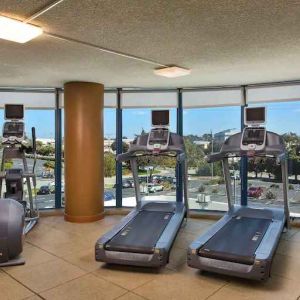 Fitness center with treadmills at the Embassy Suites by Hilton San Francisco Airport.