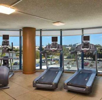 Fitness center with treadmills at the Embassy Suites by Hilton San Francisco Airport.