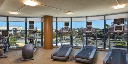 Fitness center with treadmills at the Embassy Suites by Hilton San Francisco Airport.