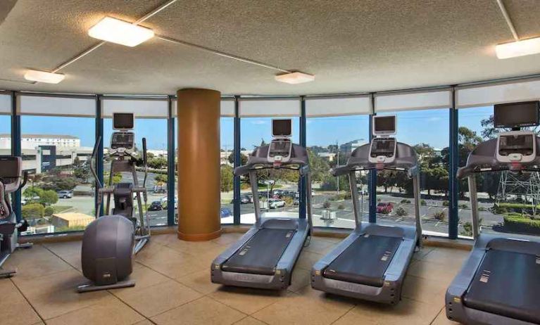 Fitness center with treadmills at the Embassy Suites by Hilton San Francisco Airport.