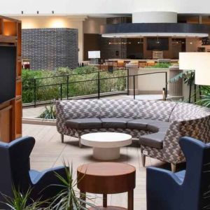 Elegant workspace in a hotel lobby at the Embassy Suites by Hilton San Francisco Airport.