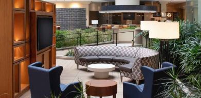 Elegant workspace in a hotel lobby at the Embassy Suites by Hilton San Francisco Airport.