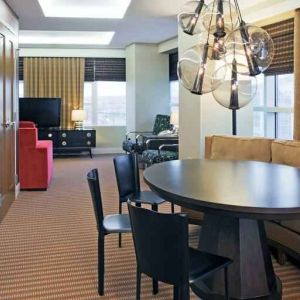 Living room with working station in a hotel suite at the Hilton Omaha.