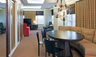 Living room with working station in a hotel suite at the Hilton Omaha.