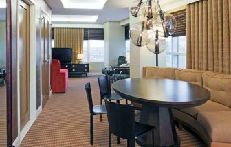 Living room with working station in a hotel suite at the Hilton Omaha.