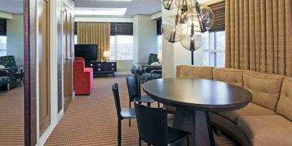 Living room with working station in a hotel suite at the Hilton Omaha.