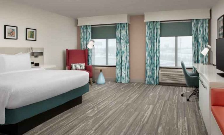 Spacious king guestroom with working station at the Hilton Garden Inn Dallas/Duncanville.