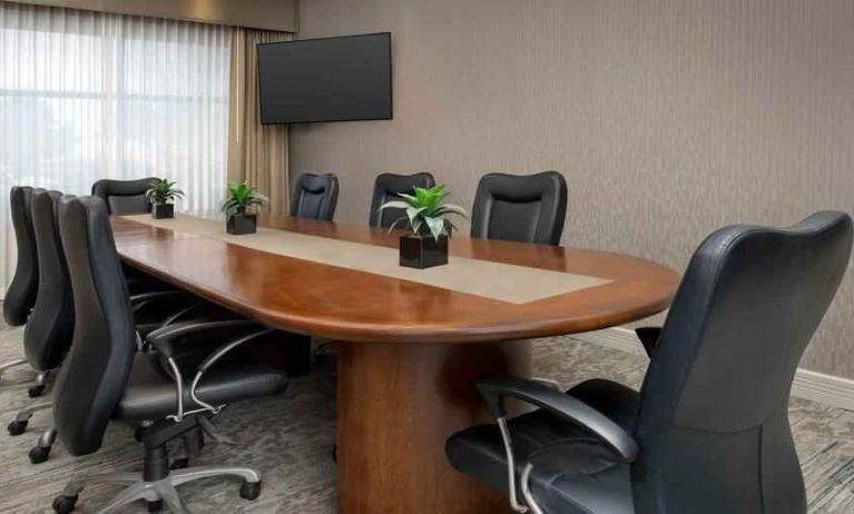 Meeting room with window and TV screen at the Hilton Garden Inn Dallas/Duncanville.