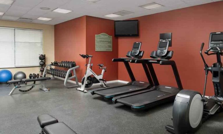 Fitness center with treadmills and weights at the Hilton Garden Inn Dallas/Duncanville.