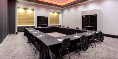 Meeting room with square table at the Hilton Garden Inn Hays.