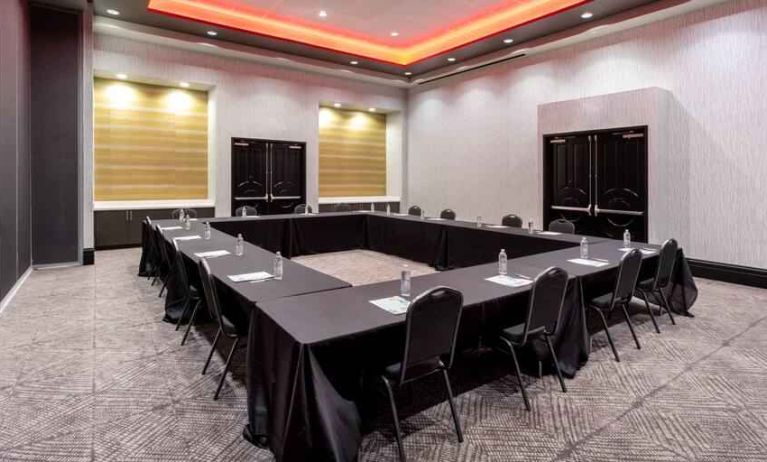 Meeting room with square table at the Hilton Garden Inn Hays.