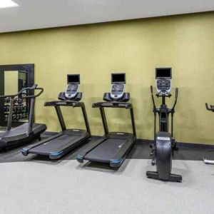 Fitness center with treadmills and weights at the Hilton Garden Inn Hays.