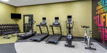 Fitness center with treadmills and weights at the Hilton Garden Inn Hays.