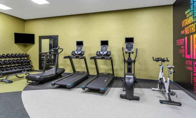 Fitness center with treadmills and weights at the Hilton Garden Inn Hays.