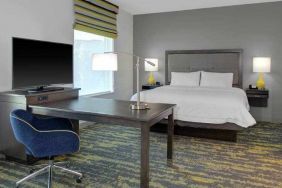 Working station in a king bedroom at the Hampton Inn & Suites by Hilton-Irvine/Orange County Airport.