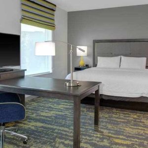 Working station in a king bedroom at the Hampton Inn & Suites by Hilton-Irvine/Orange County Airport.