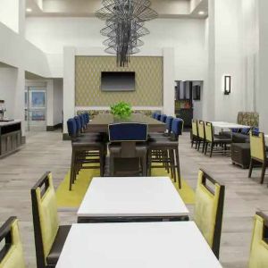 Comfortable dining area perfect as workspace at the Hampton Inn & Suites by Hilton-Irvine/Orange County Airport.