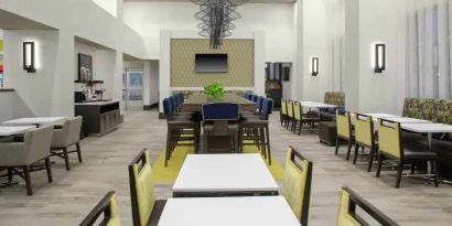 Comfortable dining area perfect as workspace at the Hampton Inn & Suites by Hilton-Irvine/Orange County Airport.