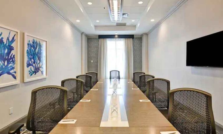 Small meeting room with window at the Embassy Suites by Hilton Miami - International Airport.