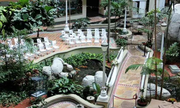 Beautiful outdoor patio with garden at the Embassy Suites by Hilton Miami - International Airport.