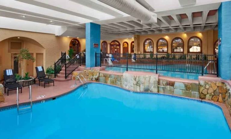 Relaxing indoor pool area at the Embassy Suites by Hilton Kansas City Plaza.