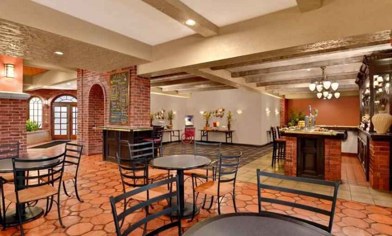 Comfortable dining area perfect as workspace at the Embassy Suites by Hilton Kansas City Plaza.