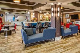 colorful lobby and coworking space at Hampton Inn San Francisco Airport.