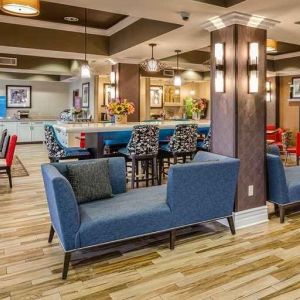 colorful lobby and coworking space at Hampton Inn San Francisco Airport.