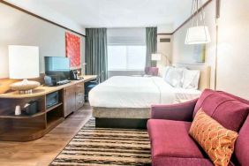 Bright and comfortable king guestroom at the Hilton Garden Inn Minneapolis Airport Mall of America.