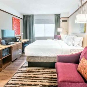 Bright and comfortable king guestroom at the Hilton Garden Inn Minneapolis Airport Mall of America.