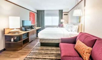 Bright and comfortable king guestroom at the Hilton Garden Inn Minneapolis Airport Mall of America.