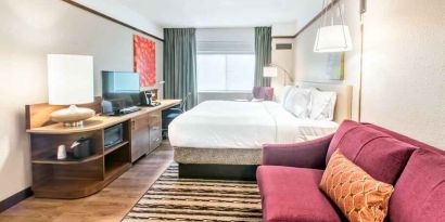 Bright and comfortable king guestroom at the Hilton Garden Inn Minneapolis Airport Mall of America.