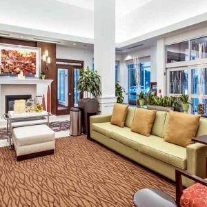 Workspace with lounges in a hotel lobby at the Hilton Garden Inn Minneapolis Airport Mall of America.