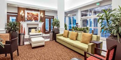 Workspace with lounges in a hotel lobby at the Hilton Garden Inn Minneapolis Airport Mall of America.