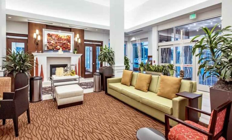 Workspace with lounges in a hotel lobby at the Hilton Garden Inn Minneapolis Airport Mall of America.