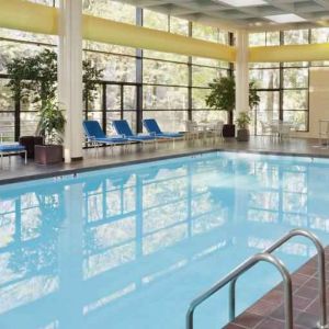 Relaxing indoor pool with lounges at the DoubleTree by Hilton Kansas City - Overland Park.