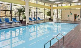 Relaxing indoor pool with lounges at the DoubleTree by Hilton Kansas City - Overland Park.