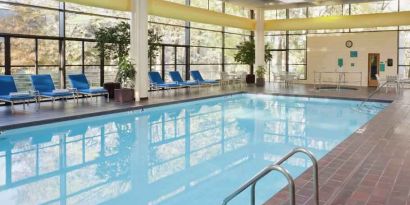 Relaxing indoor pool with lounges at the DoubleTree by Hilton Kansas City - Overland Park.