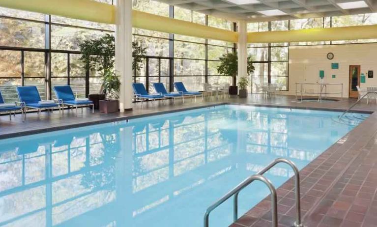 Relaxing indoor pool with lounges at the DoubleTree by Hilton Kansas City - Overland Park.