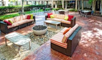 Beautiful outdoor patio with garden perfect as workspace at the DoubleTree by Hilton Kansas City - Overland Park.