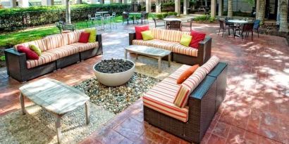 Beautiful outdoor patio with garden perfect as workspace at the DoubleTree by Hilton Kansas City - Overland Park.