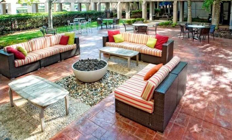 Beautiful outdoor patio with garden perfect as workspace at the DoubleTree by Hilton Kansas City - Overland Park.