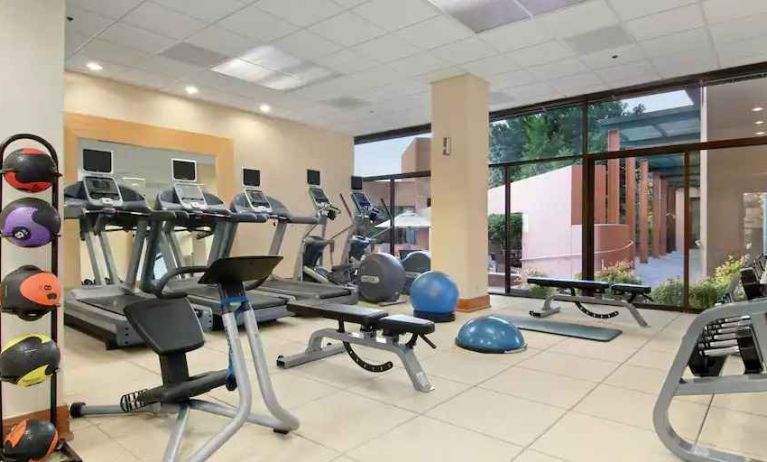 Bright fitness center with treadmills at the Hilton San Antonio-Airport.