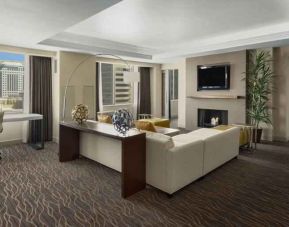 Beautiful living room with working station and seating area at the Hilton Salt Lake City Center.