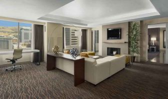 Beautiful living room with working station and seating area at the Hilton Salt Lake City Center.