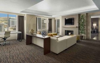 Beautiful living room with working station and seating area at the Hilton Salt Lake City Center.