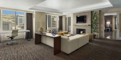 Beautiful living room with working station and seating area at the Hilton Salt Lake City Center.