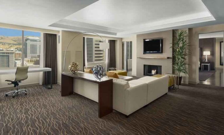 Beautiful living room with working station and seating area at the Hilton Salt Lake City Center.