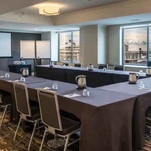 Meeting room with screen and windows at the Hilton Salt Lake City Center.